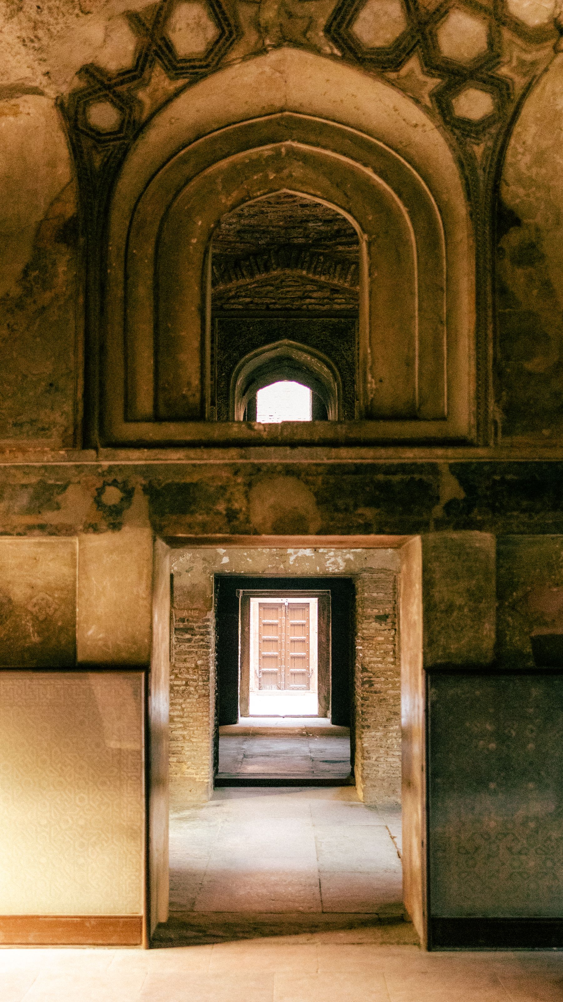 Aligned Arched Doorways And Corridor